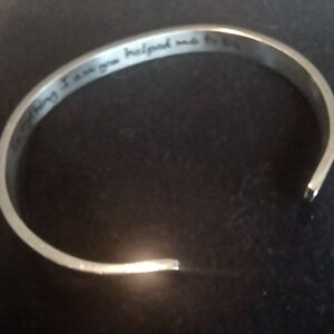 Silver tone Mom bracelet inscribed: EVERYTHIN I AM YOU HELPED ME TO BE.